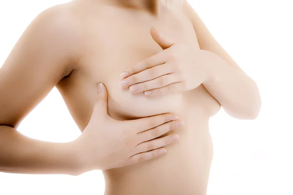 Mulher examinando seu peito — Fotografia de Stock