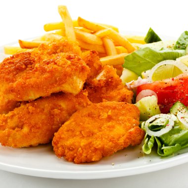 Fried chicken nuggets, French fries and vegetables clipart