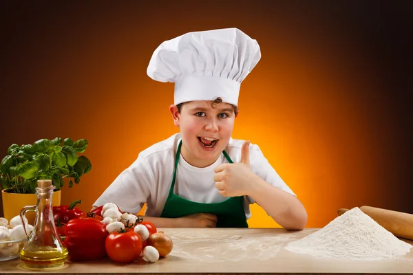 Boy making pizza dough — Stock Photo, Image