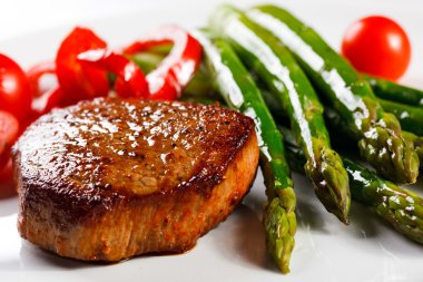 Grilled steak with asparagus clipart