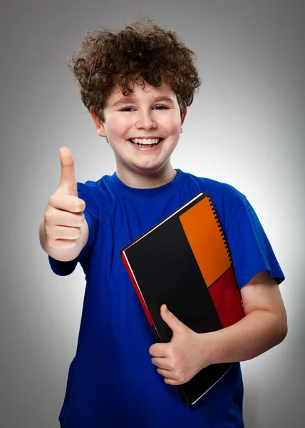 Student showing OK sign on gray background — Stock Photo, Image