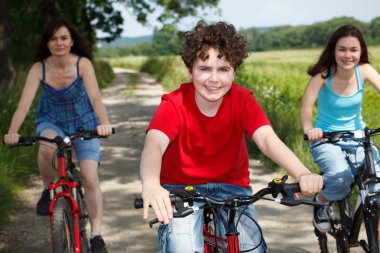 Family riding bikes clipart