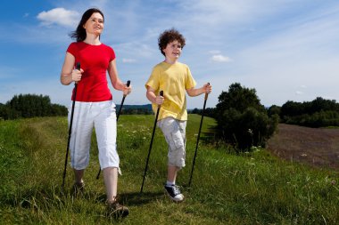 Nordic walking - mother and son outdoor clipart