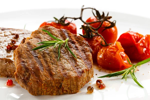 stock image Grilled steak and fried toamtoes