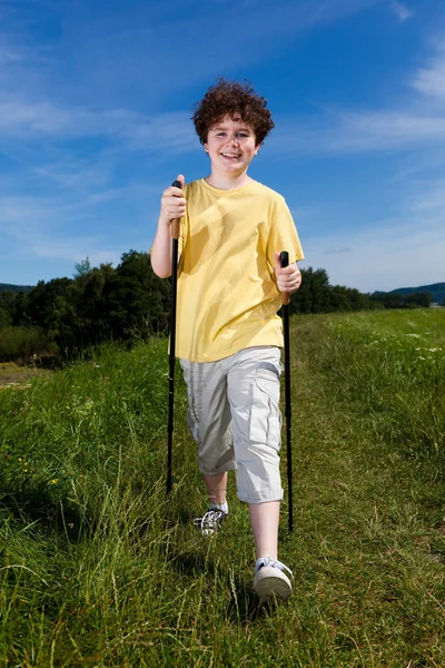 Nordic walking - active boy outdoor — Stock Photo, Image