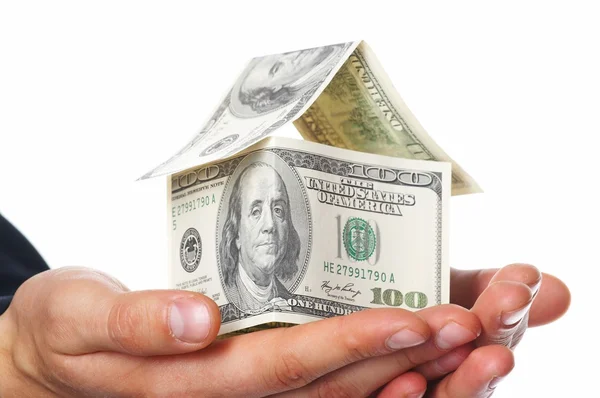 O dinheiro de casa em mãos humanas — Fotografia de Stock