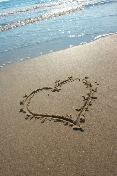 stock image Heart drawn on sand, seacoast