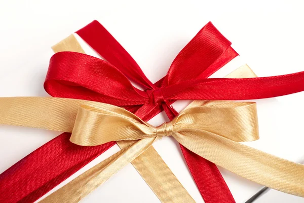 Big red, gold bow on white background — Stock Photo, Image