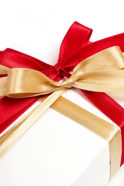 Big red, gold bow on white background Stock Photo