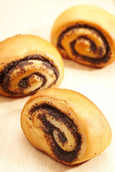 stock image Poppy rolls on the table