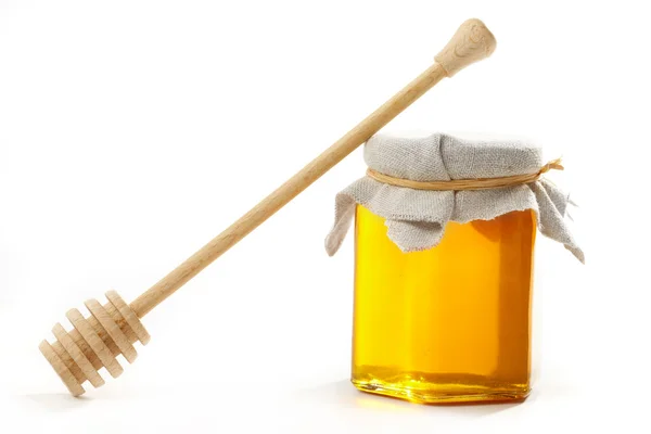 Miel con palo de madera —  Fotos de Stock