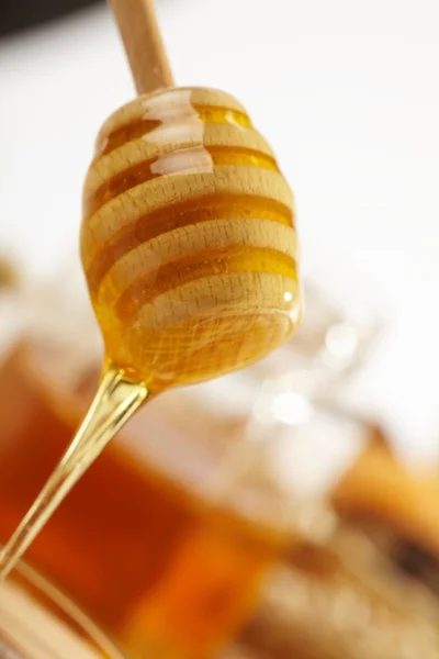 Honey with wood stick — Stock Photo, Image