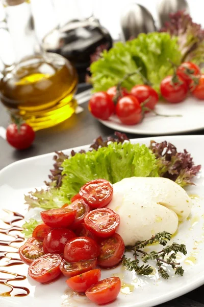 Tomatoes with mozzarella — Stock Photo, Image