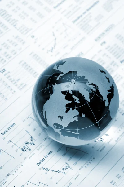 Globe on business documents Stock Picture
