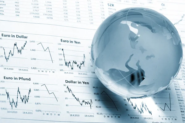 Globe on business documents Stock Picture