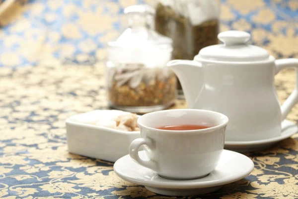 Cup of tea with a teapot — Stock Photo, Image