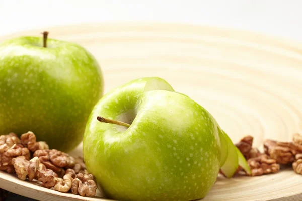 stock image Green apples with walnut