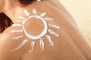 Woman with sun-shaped sun cream clipart