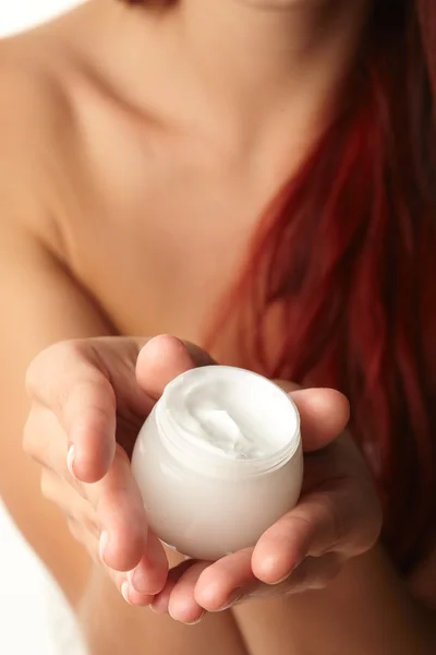 stock image Woman applying cream on her hand