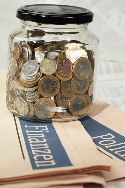 Coins in money jar — Stock Photo, Image