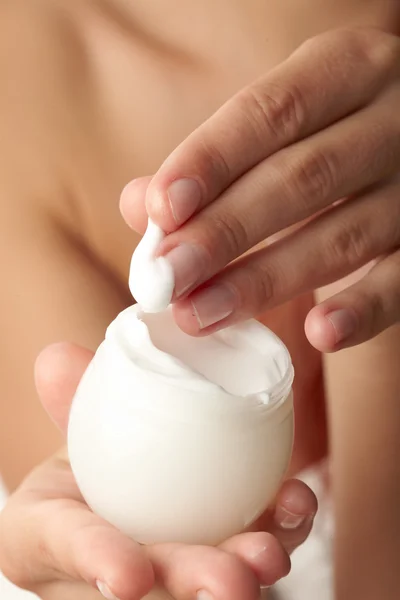 stock image Woman applying cream on her hand