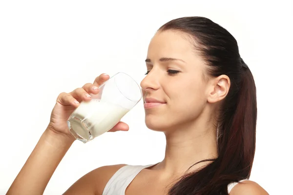 Mujer joven con vaso de leche —  Fotos de Stock