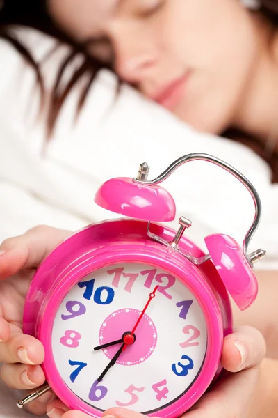 stock image Beautiful woman sleeping and alarm clock