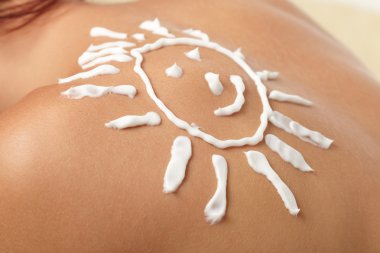 Woman with sun-shaped sun cream clipart