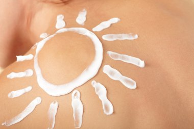 Woman with sun-shaped sun cream clipart