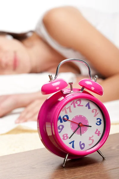 Beautiful woman sleeping and alarm clock — Stock Photo, Image