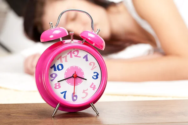 Beautiful woman sleeping and alarm clock — Stock Photo, Image
