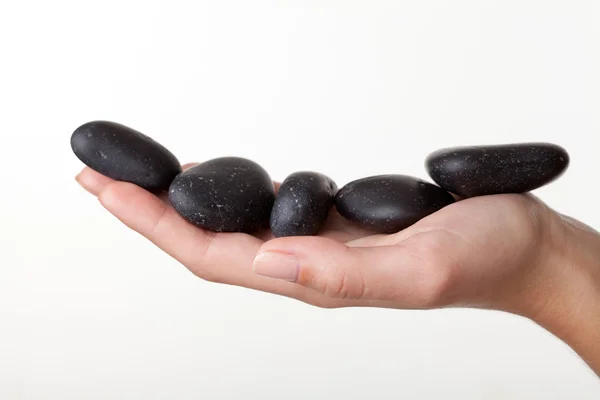 Pedras em uma mão — Fotografia de Stock