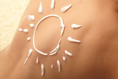 Woman with sun-shaped sun cream clipart