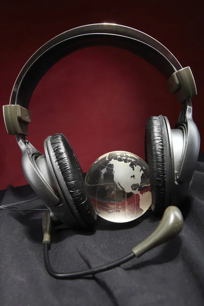 stock image Glass globe and headphones