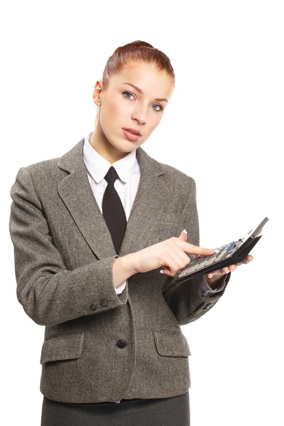 Portrait of young businesswoman with calculator — Stock Photo, Image