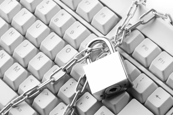 stock image Computer keyboard secured with chain and padlock