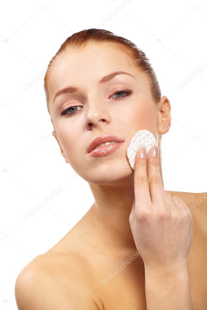 Beautiful woman with cotton swab