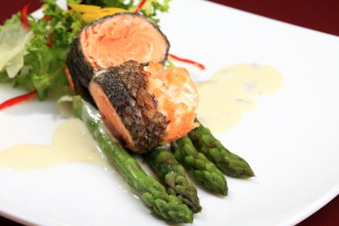 Rosemary roasted salmon served with asparagus clipart