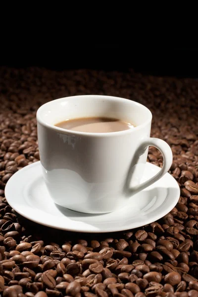 stock image Cup with coffee, costing on coffee grain