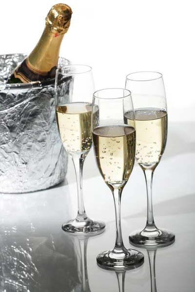 Champagne flutes and ice bucket — Stock Photo, Image