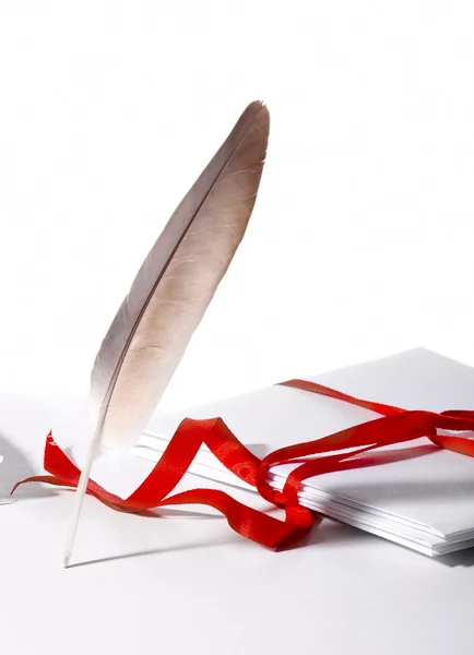Feather on background mail — Stock Photo, Image