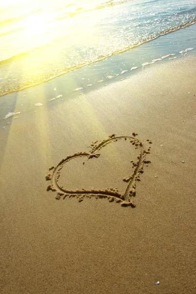 Heart drawn on sand, seacoast Stock Image