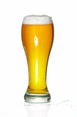 Glass of beer close-up with froth over white background clipart