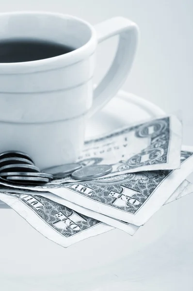 stock image Cup coffee on a money