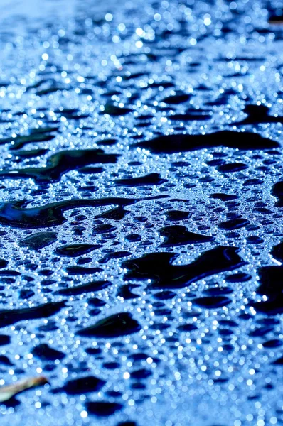 Droppar på nylagd asfalt, olja — Stockfoto