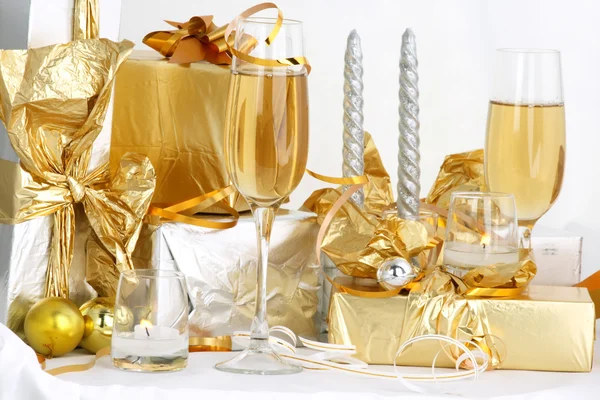 stock image Glasses of champagne , gifts