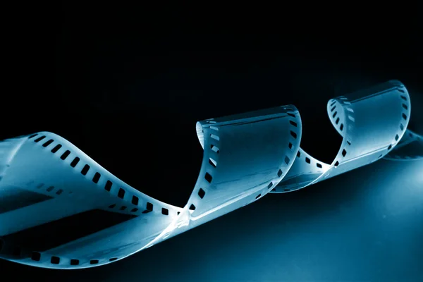 Imagen de primer plano de la película de 35 mm de rizado —  Fotos de Stock