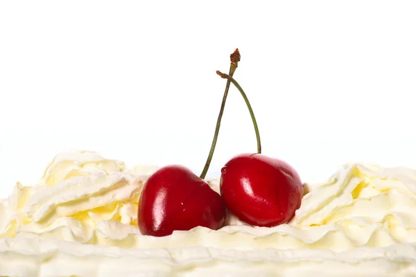 Cream, cherries on a white background — Stock Photo, Image