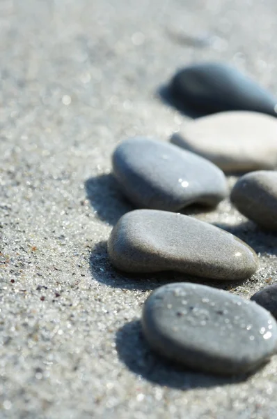 Stock image Stones on sand at the sea, a pebble