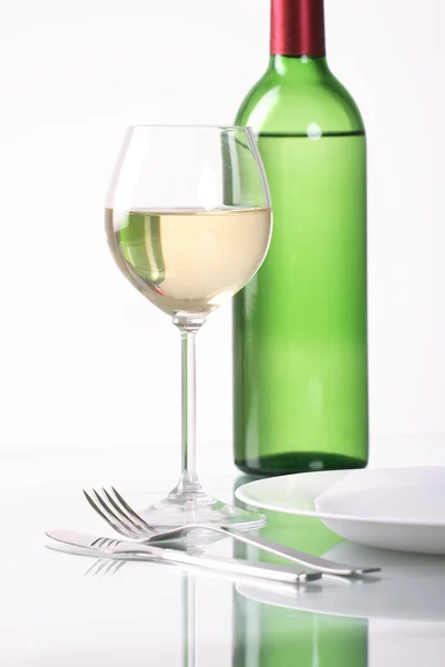 stock image Bottle and glass of wine on white background